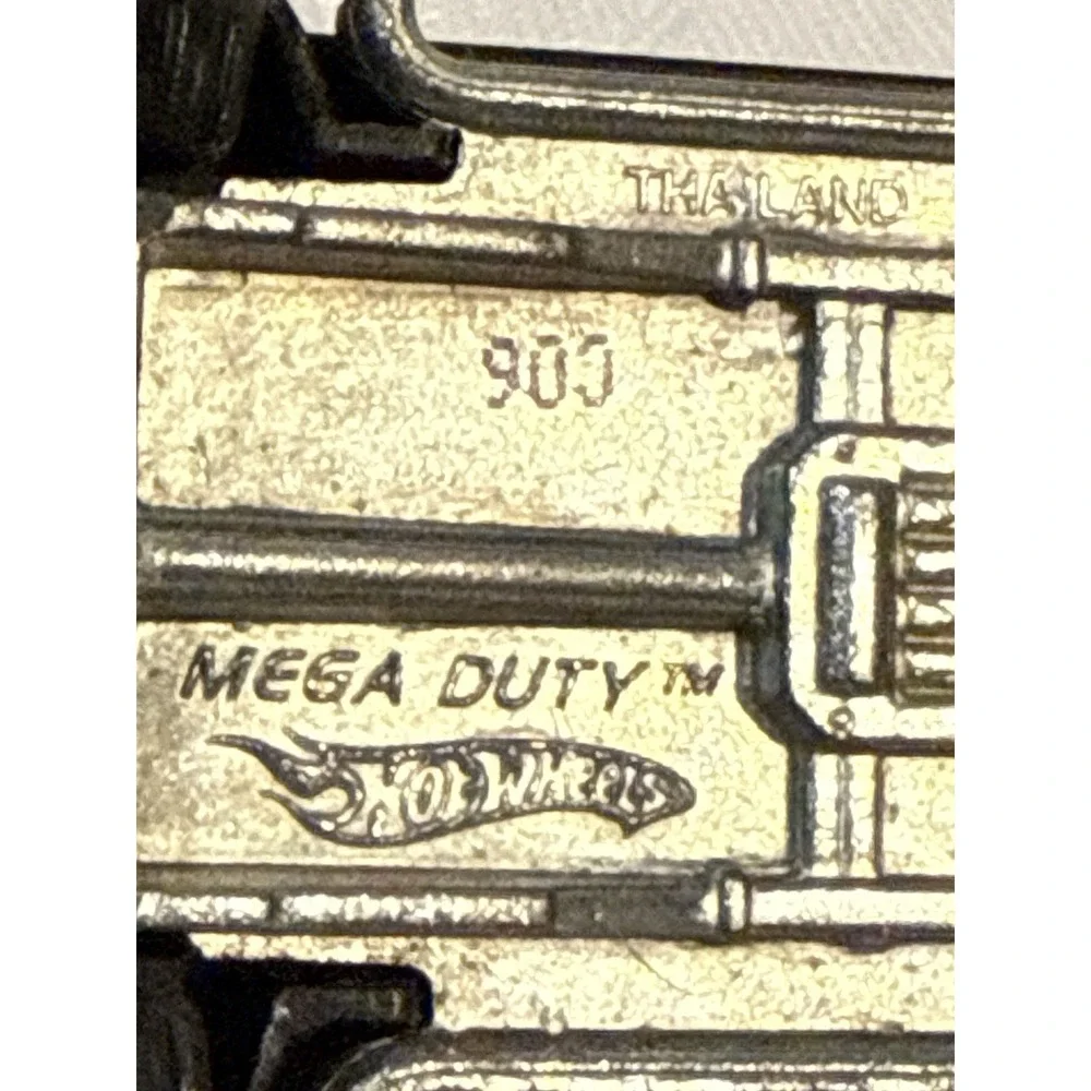 Hot Wheels Mega Duty black pickup truck, specifically the 2010 Heat Fleet